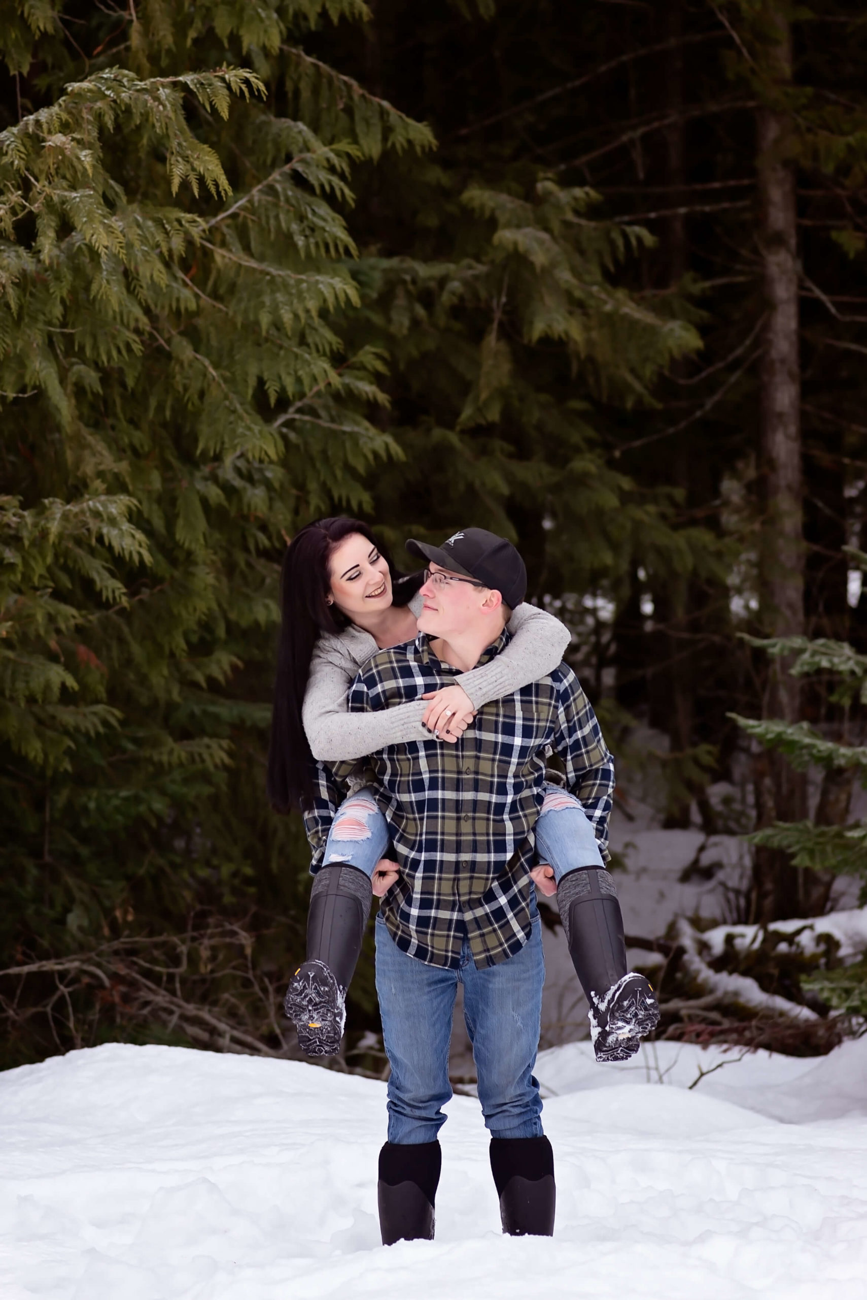 Man looking at his girlfriend during a family photography session.