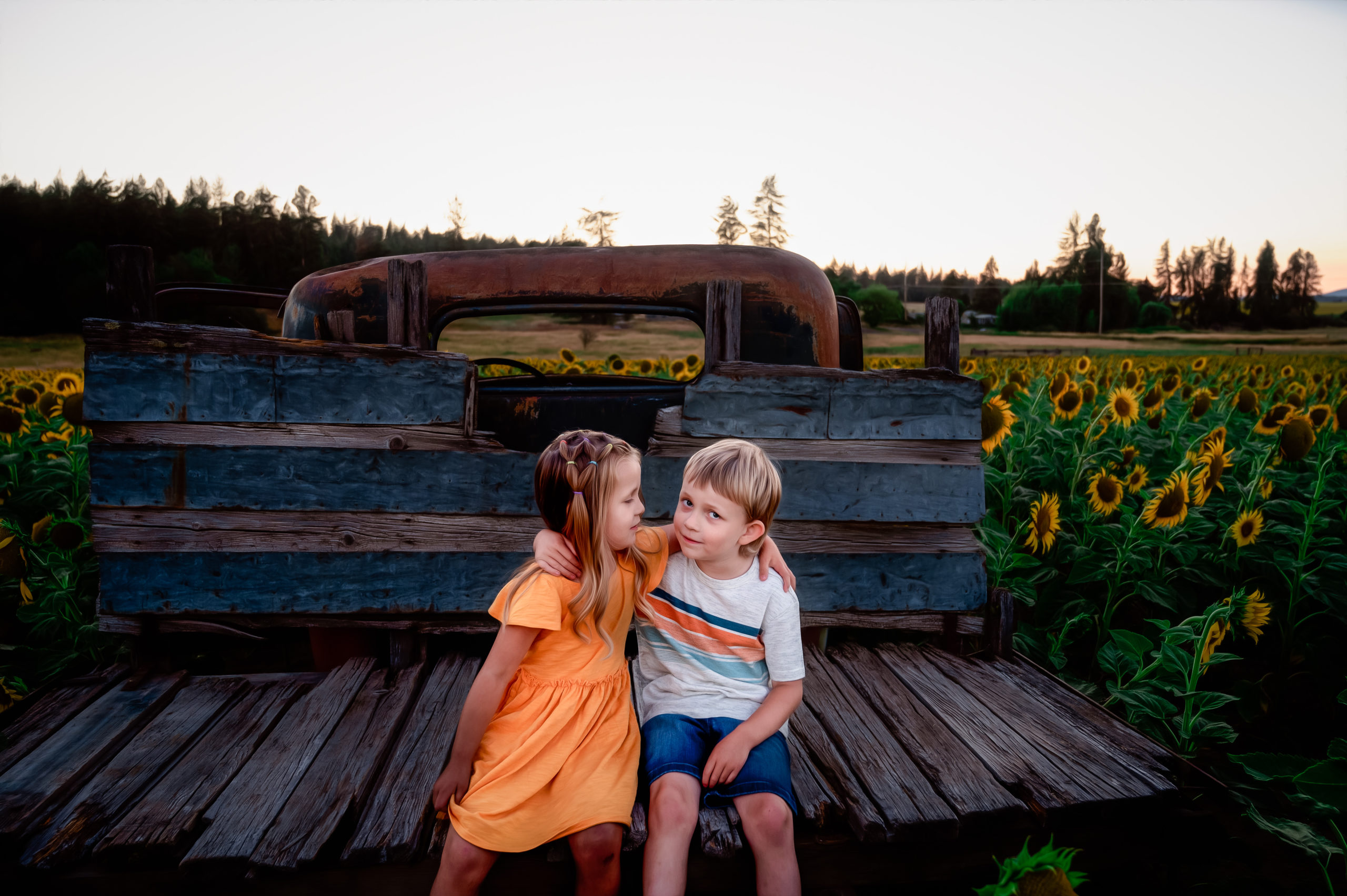 brother and sister hugging on the back of a truck things to do in spokane with kids