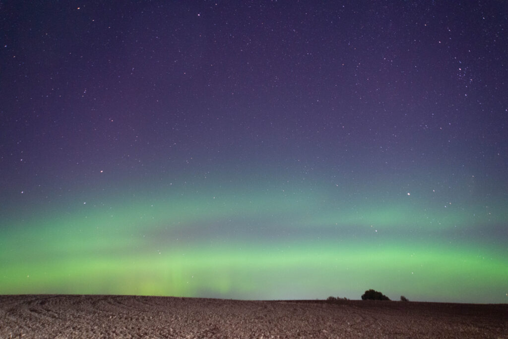 Green and purple aurora over Deer Park